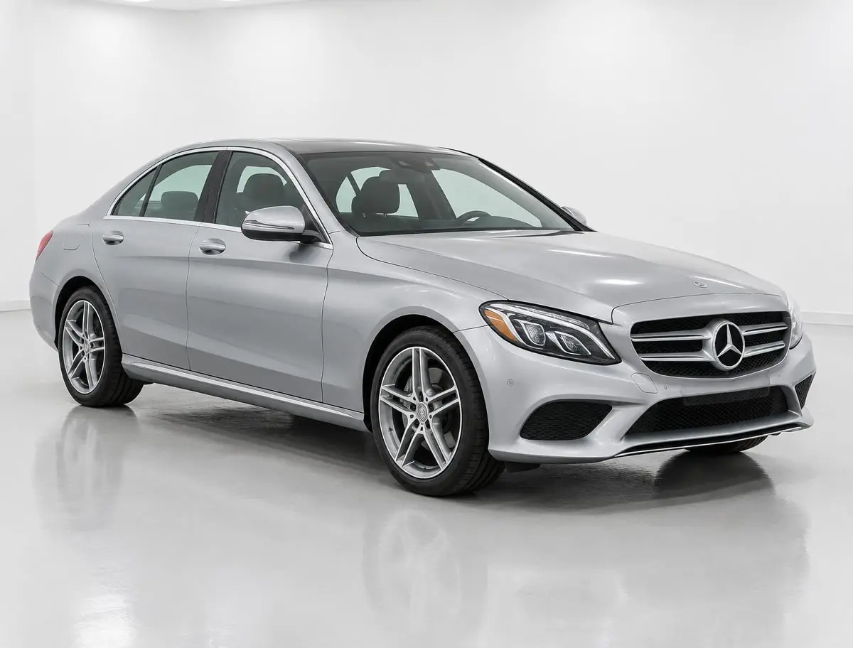 Silver luxury sedan in a professional vehicle photo bay